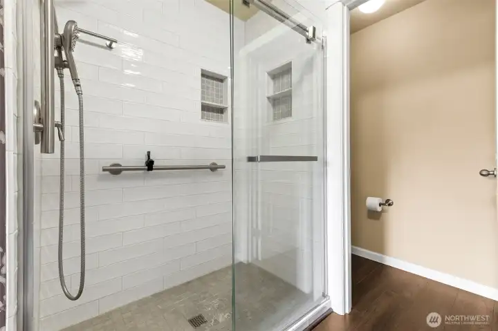 Large tiled shower was recently finished, with tiled floor and subway tiled walls. Adjustable shower head, glass door and shampoo niche complete the function! Separate water closet room. Large tiled shower was recently finished, with tiled floor and subway tiled walls. Adjustable shower head, glass door and shampoo niche complete the function! Separate water closet room.