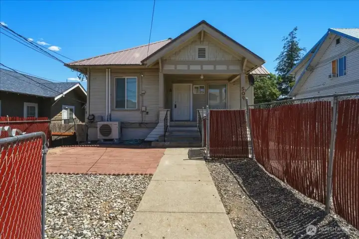 Front of home with door to main floor unit Front of home with door to main floor unit