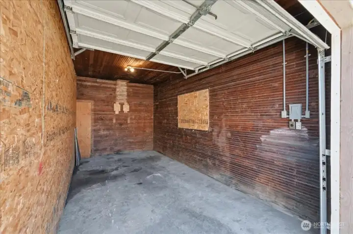 Separated garage bays with lights & power Separated garage bays with lights & power