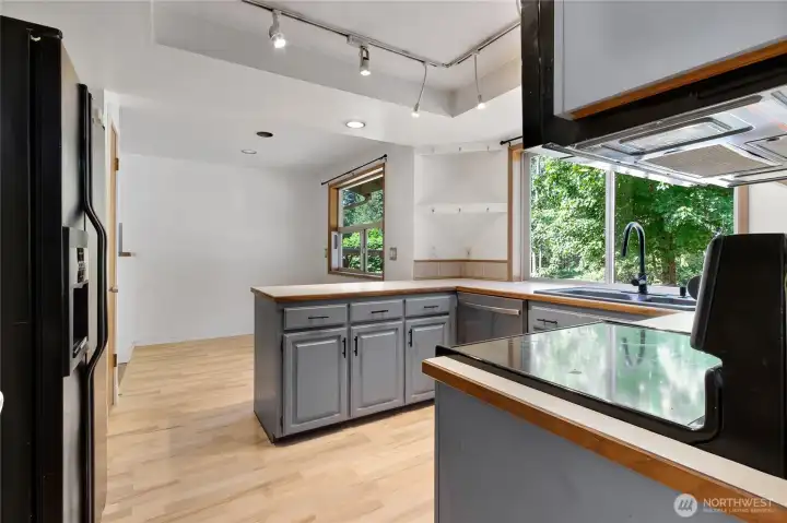 Functional kitchen with eating space, easy flow to eating area, and all appliances included.