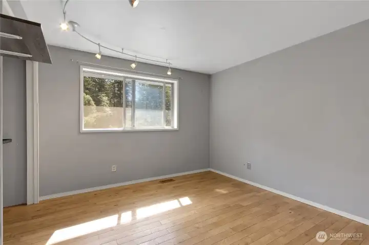 Comfortable third bedroom with flexible use—ideal for guests, home office, fitness space, or additional storage as needed.