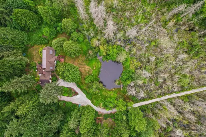Aerial of house and pond Aerial of house and pond