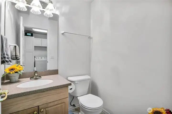 Half bath right off garage and kitchen Half bath right off garage and kitchen