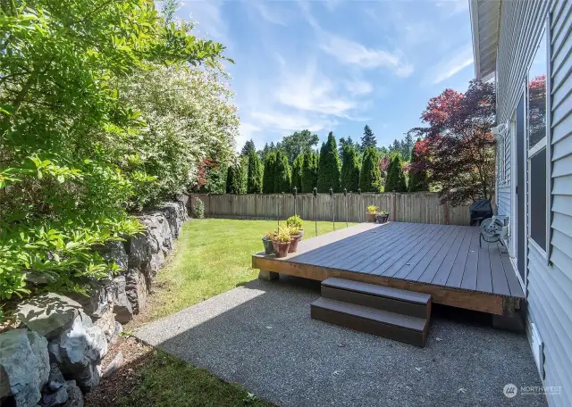 Sun drenched back yard with composite decking.