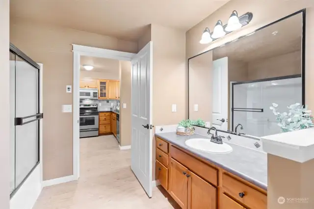 Bathroom number two with utility closet, new updated faucets and new flooring.