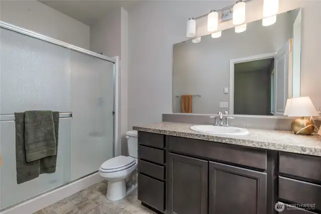 Primary bathroom with a walk in shower.