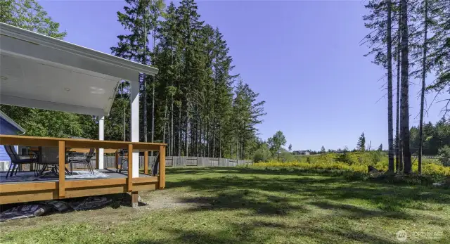 Enjoy the morning sunshine on your back deck. Behind this parcel is a 5 acre parcel, space in-between your neighbors.  Sunsets from front yard.