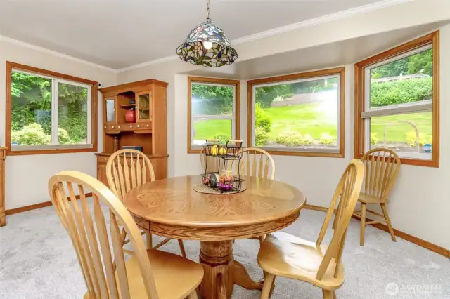 Formal dining room with bay window.