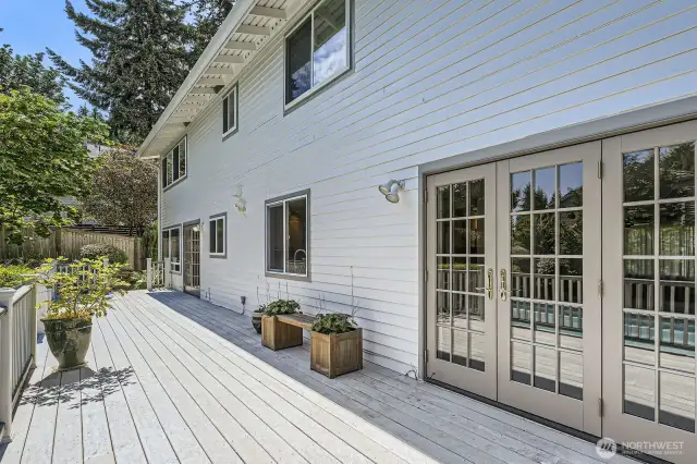 The Trex deck runs the entire length of the home and features new Marvin doors that provide access to the dining and family rooms.