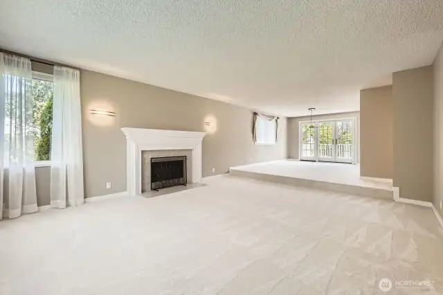 The living and dining rooms are open and light with large viewing windows and brand new carpet.