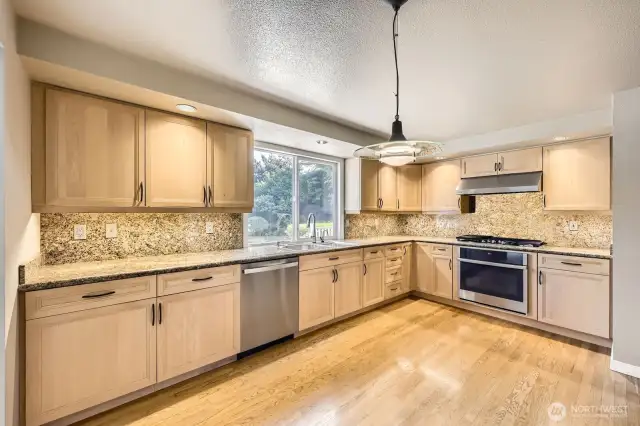 This spacious kitchen includes newer stainless steel appliances and a 6-burner gas range.