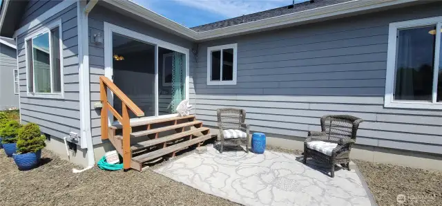 This serene outdoor haven is the perfect low-maintenance retreat—featuring a cozy back yard and direct access to the home's coastal charm. Ideal for morning coffee or evening unwinding, it’s the quintessential canal-side getaway with all the ease of Surfside living.