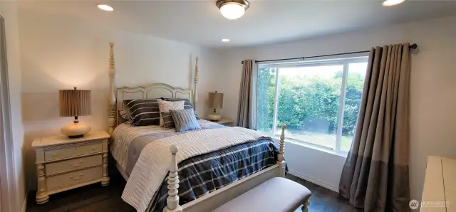 Wake up to tranquil canal views from this light-filled primary bedroom, where comfort meets coastal elegance. Featuring a spacious walk-in closet, private ensuite bathroom, and stylish finishes throughout, it’s your serene Surfside sanctuary with everyday luxury at its core.