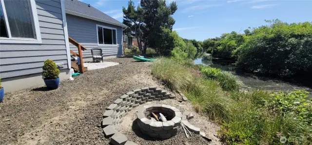 Coastal relaxation meets effortless outdoor living in this low-maintenance, canal-front backyard—featuring a fire pit, sunny back yard, and direct kayak launch for spontaneous waterfront adventures. A true Surfside gem where style and serenity flow naturally.
