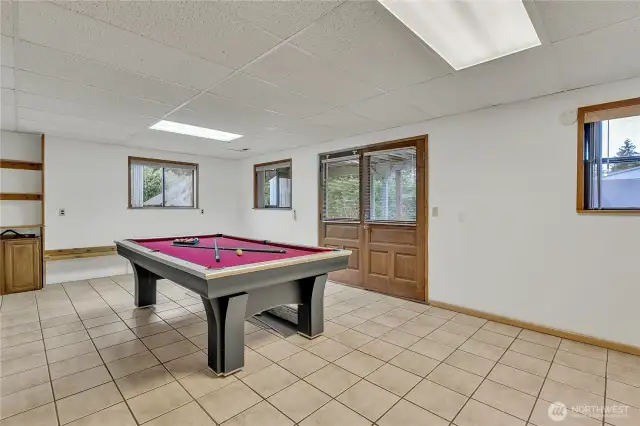 Lower level family room with outside access. The lower level is ideal for guests or potential rental income.