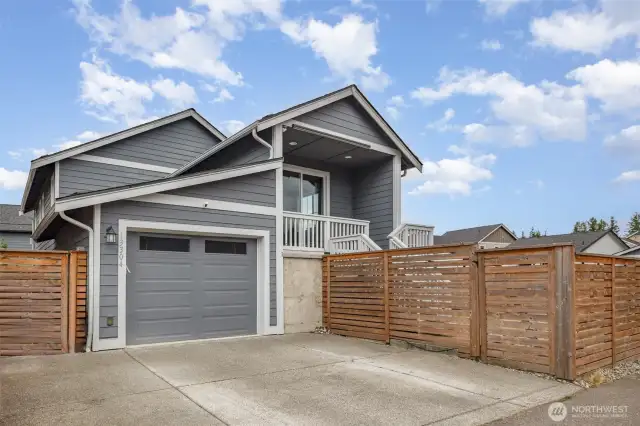 Home includes an extra wide driveway with second parking space and a fully fenced yard with 4 locking gates.