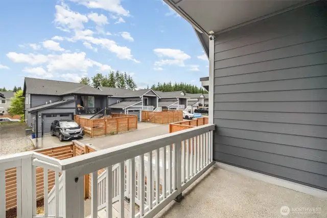 Covered back patio offers a comfortable outdoor retreat, rain or shine.