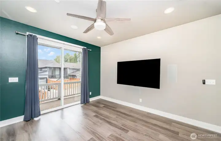 Living room features a built in home theater set-up including flush mounted 77" LG OLED Gallery Series Smart TV, Dolby Atmos 7.1 surround sound system with 5 wall speakers, 2 ceiling speakers.