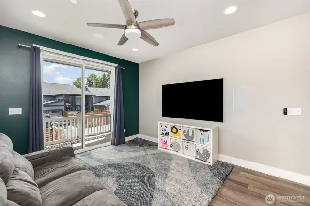 Living room features a built in home theater set-up including flush mounted 77" LG OLED Gallery Series Smart TV, Dolby Atmos 7.1 surround sound system with 5 wall speakers, 2 ceiling speakers.