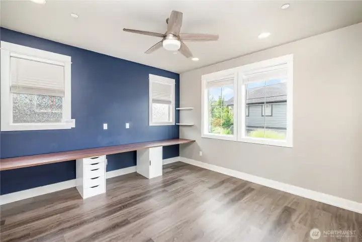 Office features a built-in three-desk setup with sleek floating shelves—ideal for remote work, studying, or creative projects.