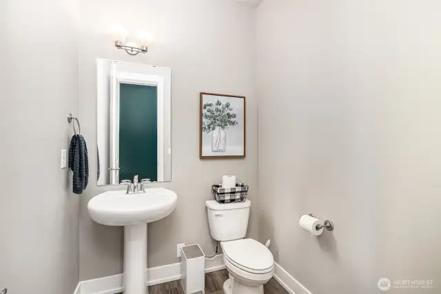 Main floor powder room includes a convenient outlet behind the toilet—perfectly suited for bidets or smart toilet seats.