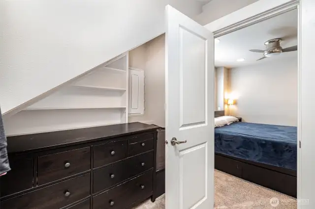 Spacious walk-in closet doubles as a tech hub, featuring a Smart Panel with Ethernet and PoE switch boards, plus a Smurf tube running to the attic—perfect for future wiring upgrades.