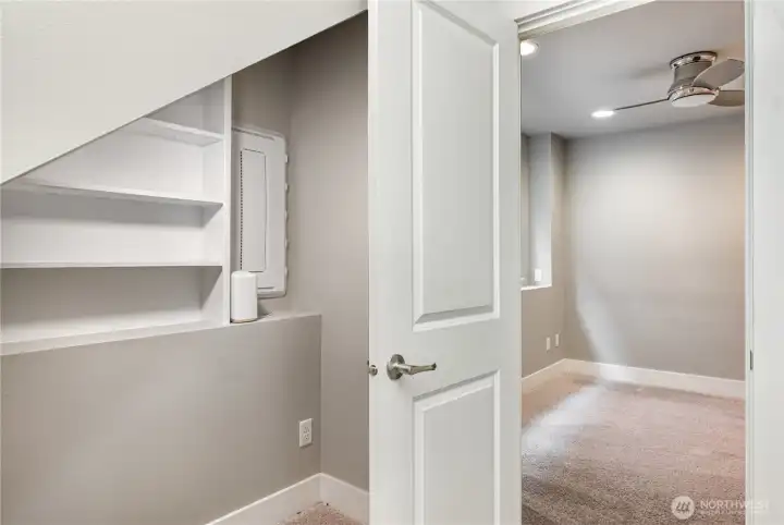 The closet doubles as a tech hub, featuring a Smart Panel with Ethernet and PoE switch boards, plus a Smurf tube running to the attic—perfect for future wiring upgrades.