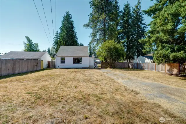 The front and back yards are open grass for your future use.
