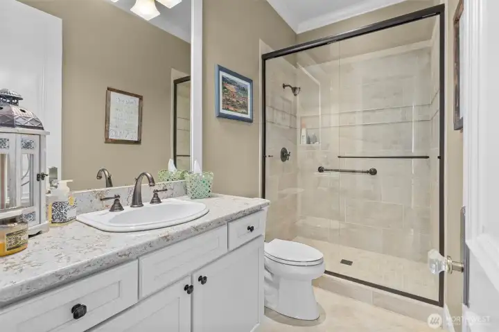 Hallway bathroom with tile floors.