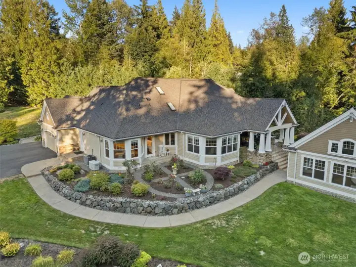 See the peaceful back yard rose garden.  Home has presidential roof.  Pool house was just reroofed with matching presidential roof.