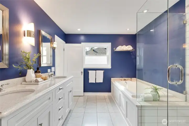 Primary bathroom with soaking tub and walk in shower.