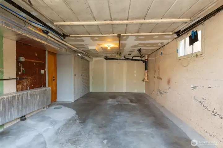 One car garage, with extra space for storage.
