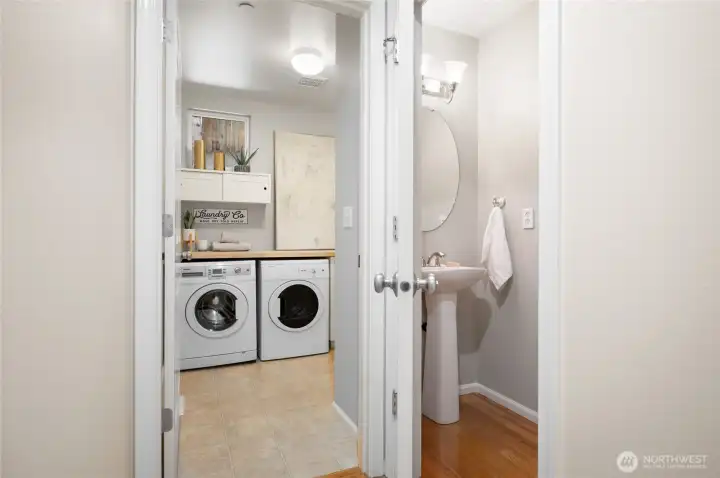 Convenient laundry area with ample storage.