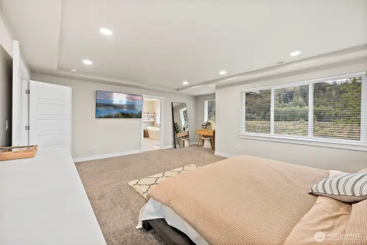 Sprawling primary suite with luxurious bath and massive walk-in closet