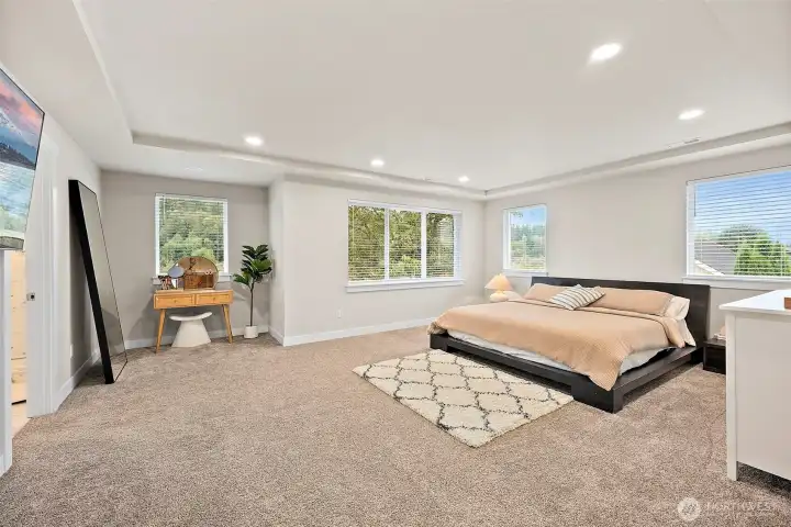 Sprawling primary suite with luxurious bath and massive walk-in closet