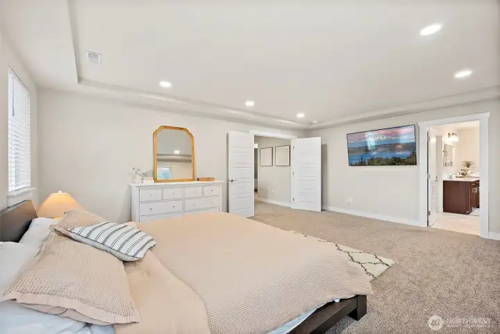 Sprawling primary suite with luxurious bath and massive walk-in closet