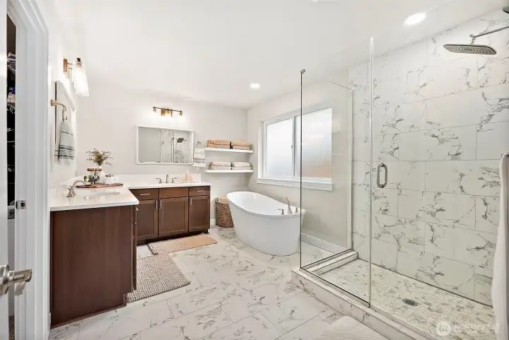 Sprawling primary suite with luxurious bath and massive walk-in closet