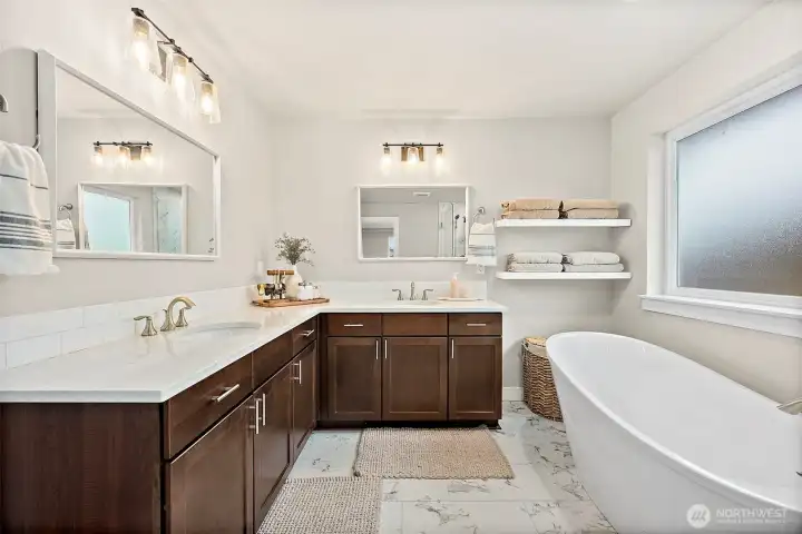 Sprawling primary suite with luxurious bath and massive walk-in closet