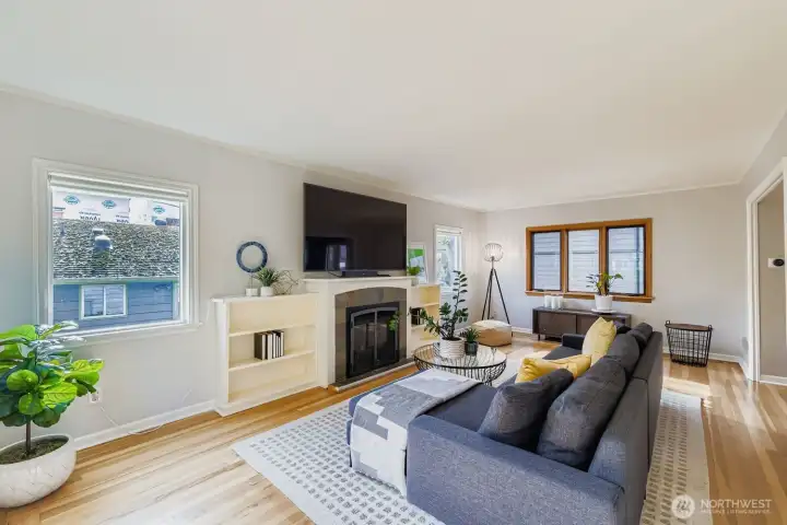 The living room is bright and welcoming, filled with natural light and perfect for both relaxing and entertaining.