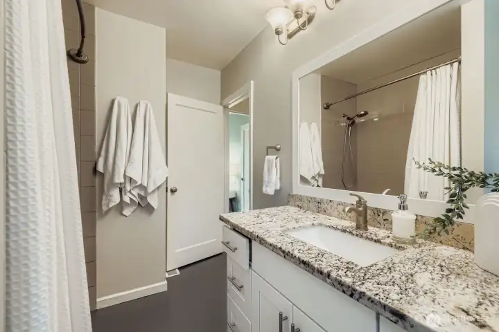 Both bathrooms have been refreshed with modern touches and functional design, making daily routines feel effortless.