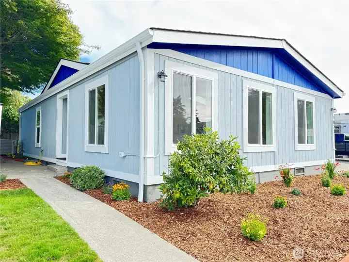 Path leads to private patio near the back door.