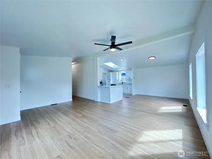Big open concept living space. The kitchen, dining room, and living room flow together. Large and new south facing windows provide plenty of light!