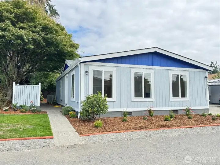 Freshly updated landscaping. Mix of new plants, and mature plants.