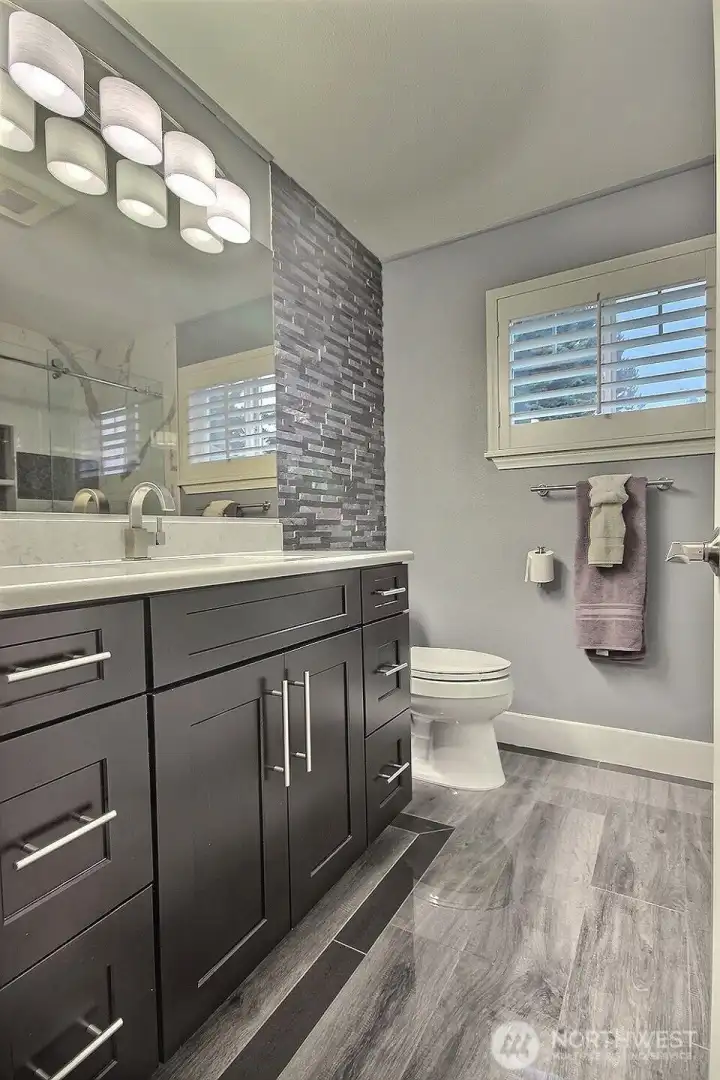 Upper full bath with tub and shower