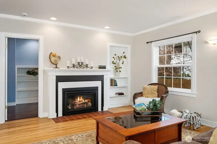 Formal living with gas fireplace and access to private studio space & 1/2 bath