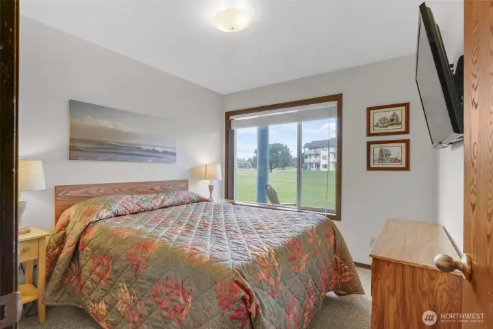 Main condo bedroom with king bed