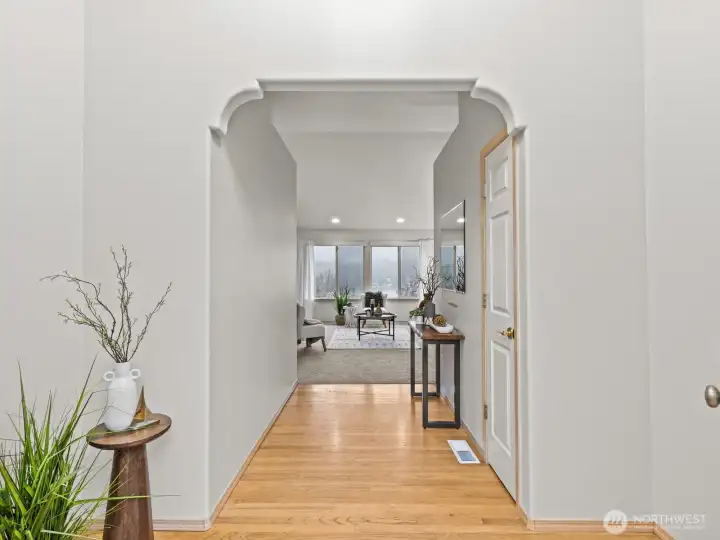 As you enter, a bright and airy foyer greets you along with the warmth of the hardwood floors.
