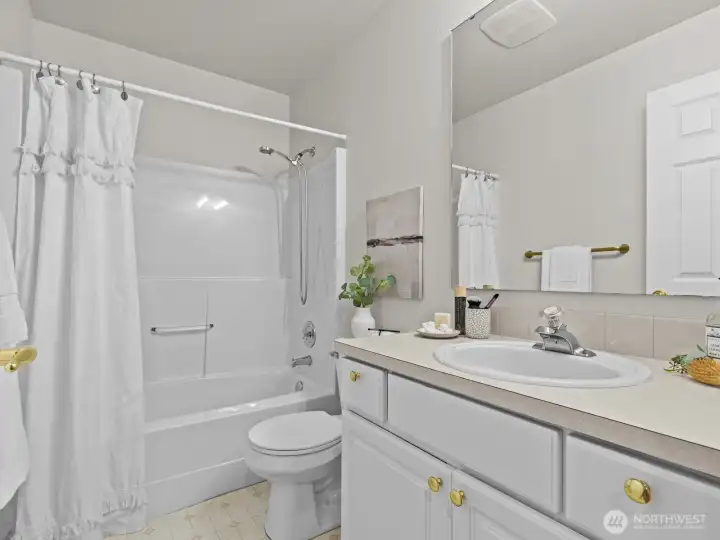 Next door, the conveniently located bathroom. It's also just down the hall from the living room.