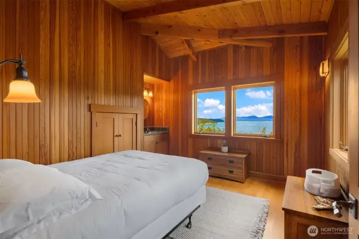 Main floor guest bedroom. Each bedroom has its own vanity area with sink- making it convenient to host overnight guests.