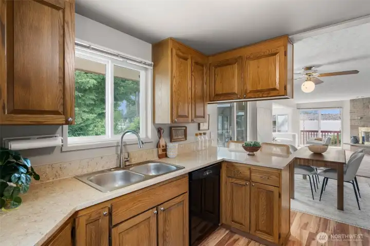 Kitchen looks out over the back deck and towards the water.